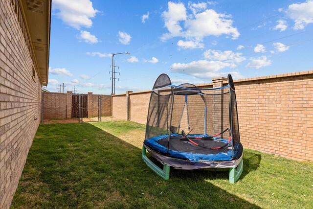 3101 Fairfield Ln, Midland, TX 79705 - view of yard featuring a trampoline