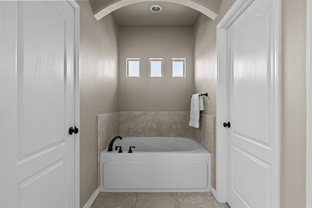 3101 Fairfield Ln, Midland, TX 79705 - bathroom featuring a bath and tile patterned floors