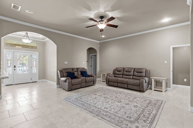 3101 Fairfield Ln, Midland, TX 79705 - living area with arched walkways, ceiling fan, baseboards, ornamental molding, and light tile patterned floors
