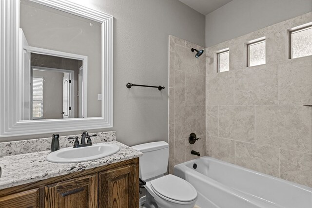 3101 Fairfield Ln, Midland, TX 79705 - bathroom featuring toilet, vanity, and shower / tub combination