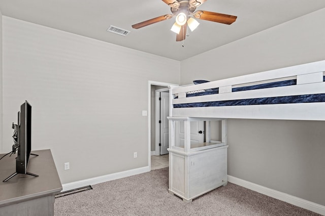 3101 Fairfield Ln, Midland, TX 79705 - unfurnished bedroom featuring carpet flooring, baseboards, and ceiling fan
