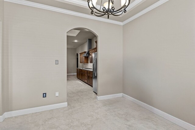 3101 Fairfield Ln, Midland, TX 79705 - empty room featuring arched walkways, crown molding, a chandelier, baseboards, and light tile patterned flooring