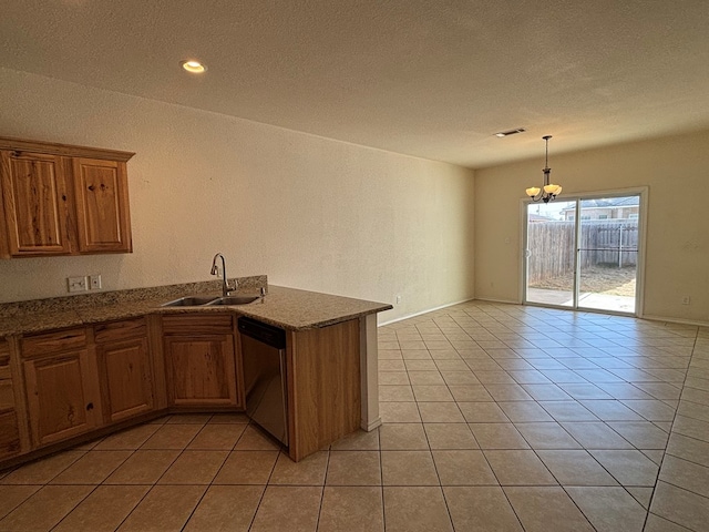 kitchen featuring stainless steel dishwasher, light tile patterned floors, visible vents, and a sink