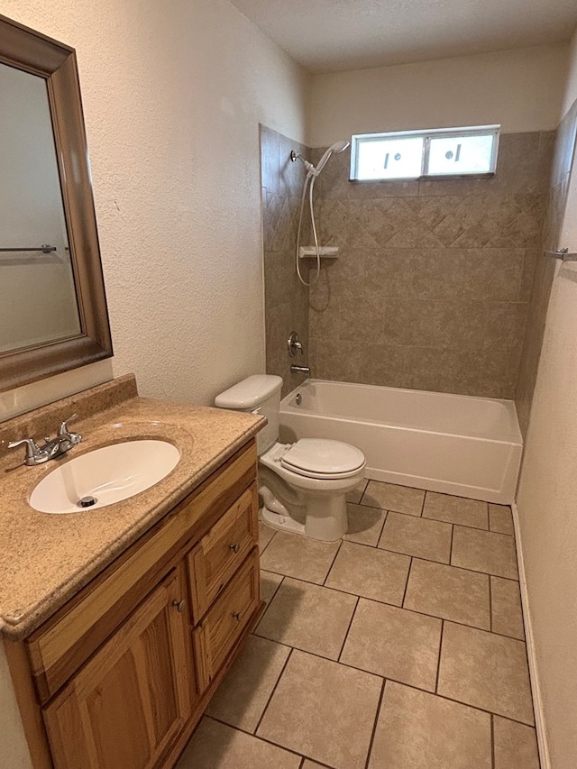 bathroom with vanity, tile patterned floors, toilet, and tub / shower combination