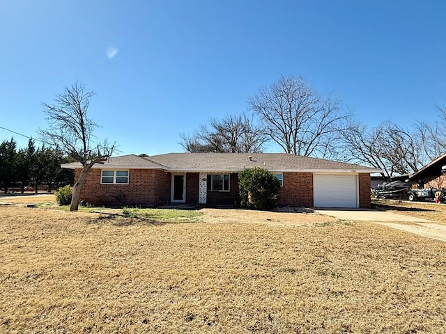 single story home featuring a garage and a front yard