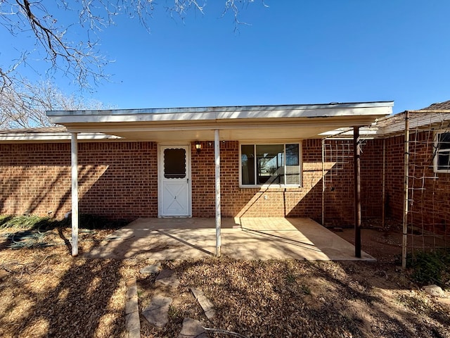 back of property featuring a patio area