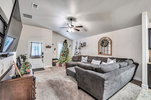 carpeted living room with vaulted ceiling and ceiling fan