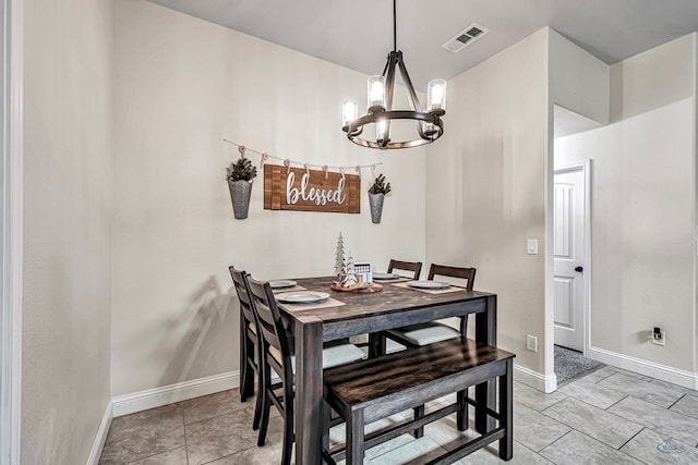 tiled dining space with a notable chandelier