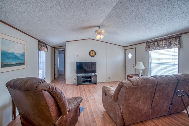 1828 S Redbud St, Pecos, TX 79772 - living area featuring crown molding, ceiling fan, lofted ceiling, and light wood-style floors