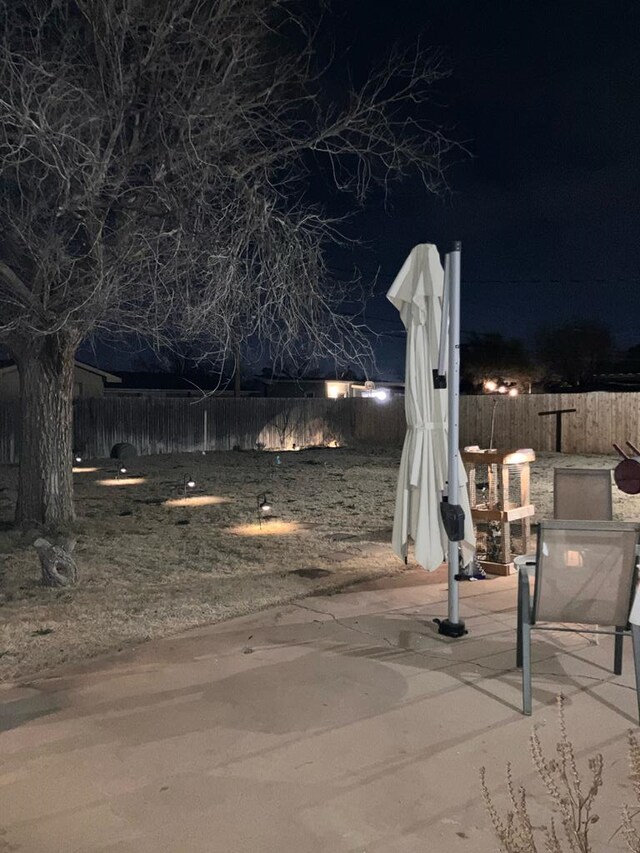 view of home's community featuring a fenced backyard and a patio