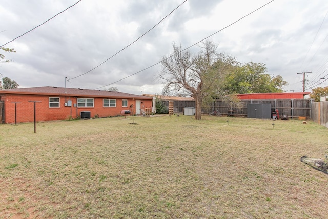 view of yard with a fenced backyard and cooling unit