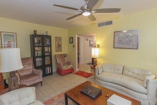 living room with visible vents, ceiling fan, and light tile patterned floors