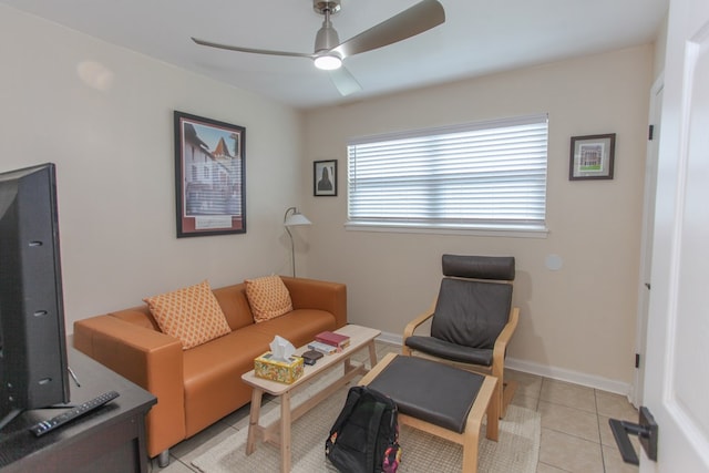 tiled living room with ceiling fan