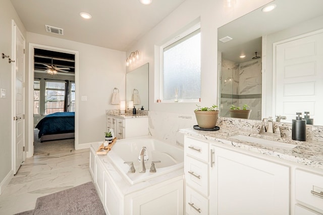 bathroom featuring vanity, independent shower and bath, and ceiling fan