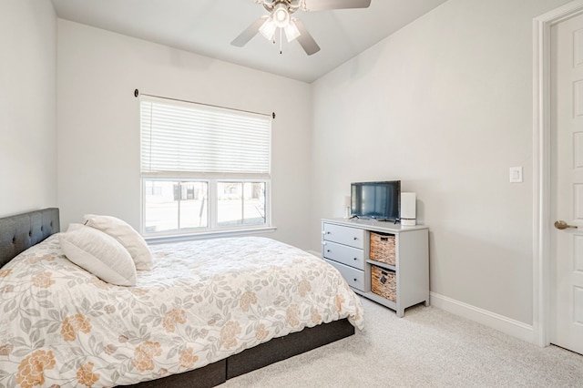 bedroom featuring ceiling fan and light carpet