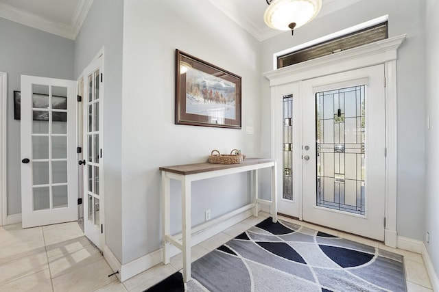 entrance foyer with light tile patterned floors, crown molding, and french doors