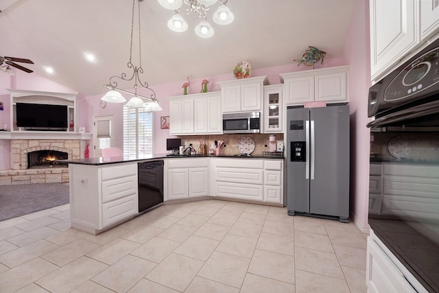 kitchen featuring kitchen peninsula, appliances with stainless steel finishes, ceiling fan, white cabinets, and hanging light fixtures