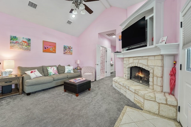1201 Breckenridge Dr, Midland, TX 79705 - carpeted living area featuring ceiling fan, a stone fireplace, beamed ceiling, high vaulted ceiling, and tile patterned floors