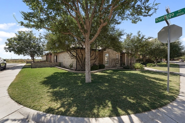 view of side of property featuring a lawn