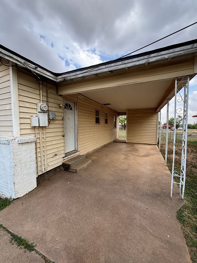 exterior space featuring a carport