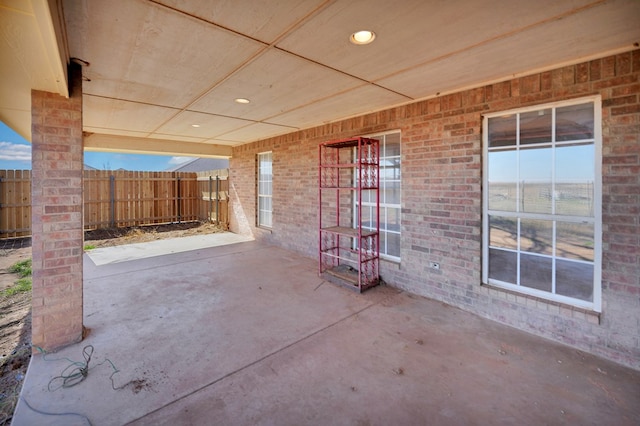 view of patio / terrace featuring fence