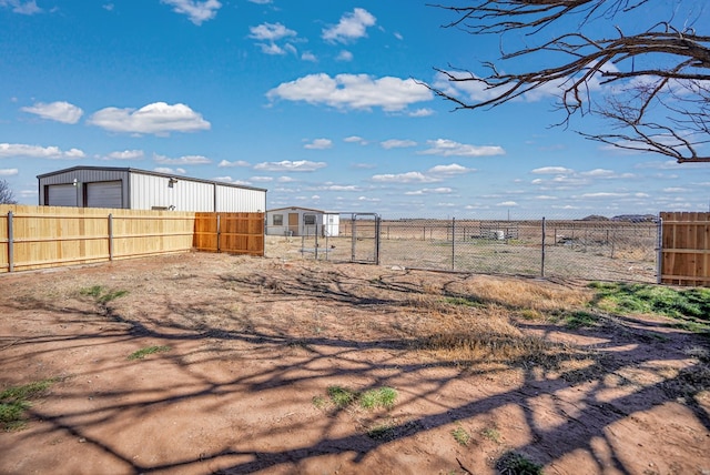 view of yard with an outbuilding and fence