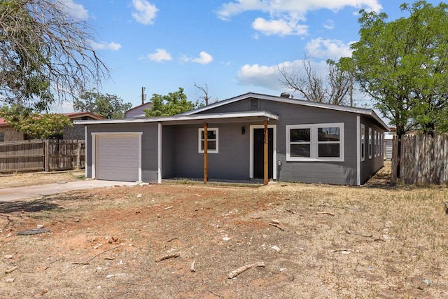 3902 Thomason Dr, Midland, TX 79703 - view of front facade featuring a garage and concrete driveway