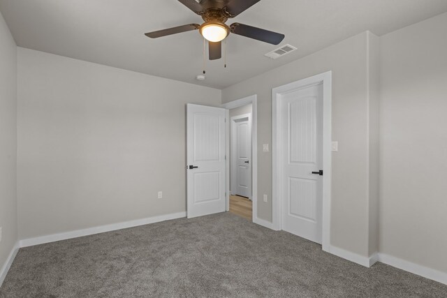 3902 Thomason Dr, Midland, TX 79703 - unfurnished bedroom with carpet, baseboards, and ceiling fan