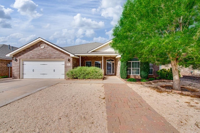 504 Wagner, Midland, TX 79706 - ranch-style home featuring brick siding, driveway, an attached garage, and a shingled roof