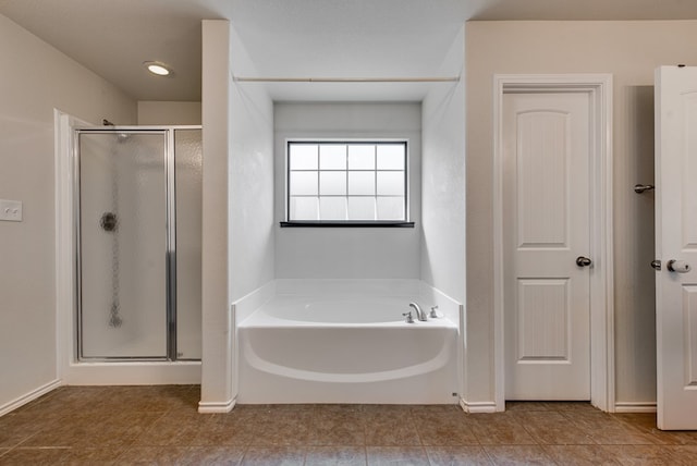 504 Wagner, Midland, TX 79706 - full bathroom featuring a stall shower, a garden tub, and tile patterned flooring
