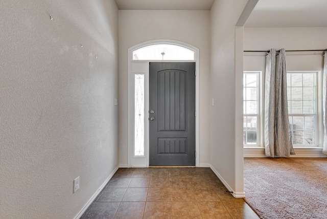 504 Wagner, Midland, TX 79706 - entryway with plenty of natural light, baseboards, tile patterned floors, and a textured wall