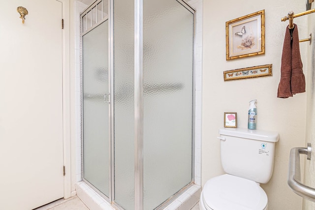 3108 Seaboard Ave, Midland, TX 79705 - full bathroom featuring a shower stall, toilet, and tile patterned flooring