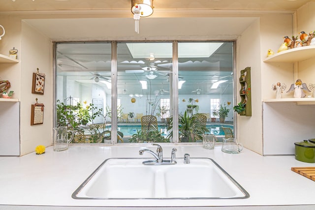 3108 Seaboard Ave, Midland, TX 79705 - kitchen with a sink, open shelves, a ceiling fan, and light countertops