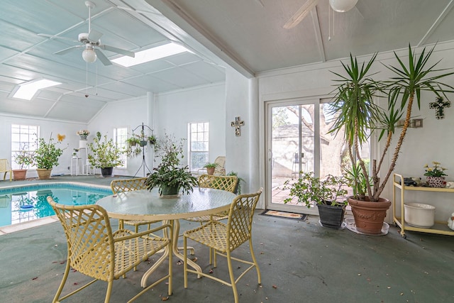 3108 Seaboard Ave, Midland, TX 79705 - dining area featuring a ceiling fan, plenty of natural light, concrete flooring, vaulted ceiling, and a skylight
