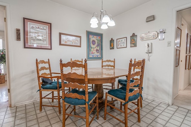 3108 Seaboard Ave, Midland, TX 79705 - dining room with a chandelier, baseboards, and light flooring