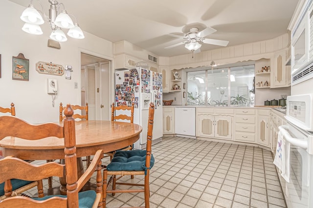 3108 Seaboard Ave, Midland, TX 79705 - dining space featuring a ceiling fan and a chandelier