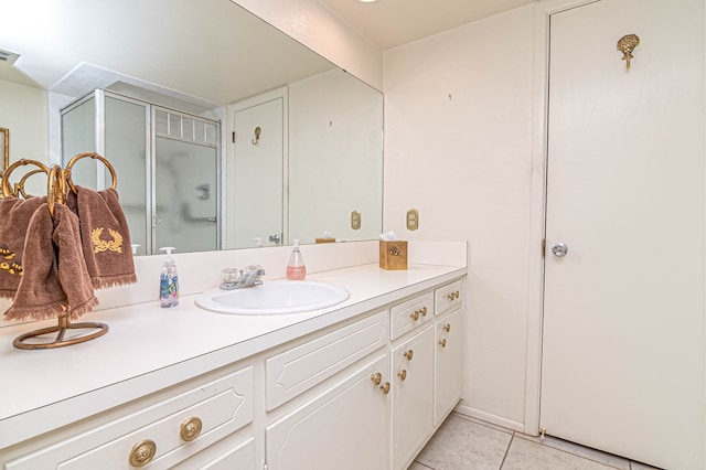 3108 Seaboard Ave, Midland, TX 79705 - bathroom featuring vanity, tile patterned flooring, and a shower stall