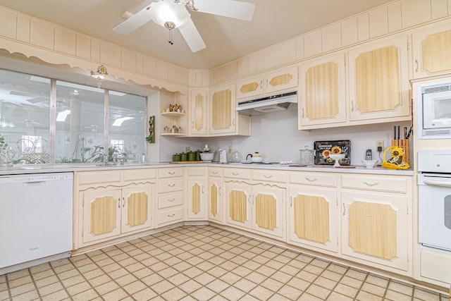 3108 Seaboard Ave, Midland, TX 79705 - kitchen with white appliances, under cabinet range hood, light countertops, ceiling fan, and light floors