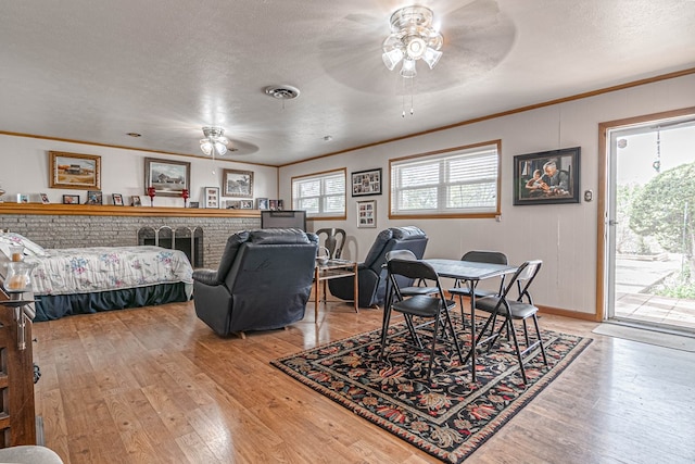 3108 Seaboard Ave, Midland, TX 79705 - dining room with ceiling fan, crown molding, light wood-type flooring, a textured ceiling, and baseboards