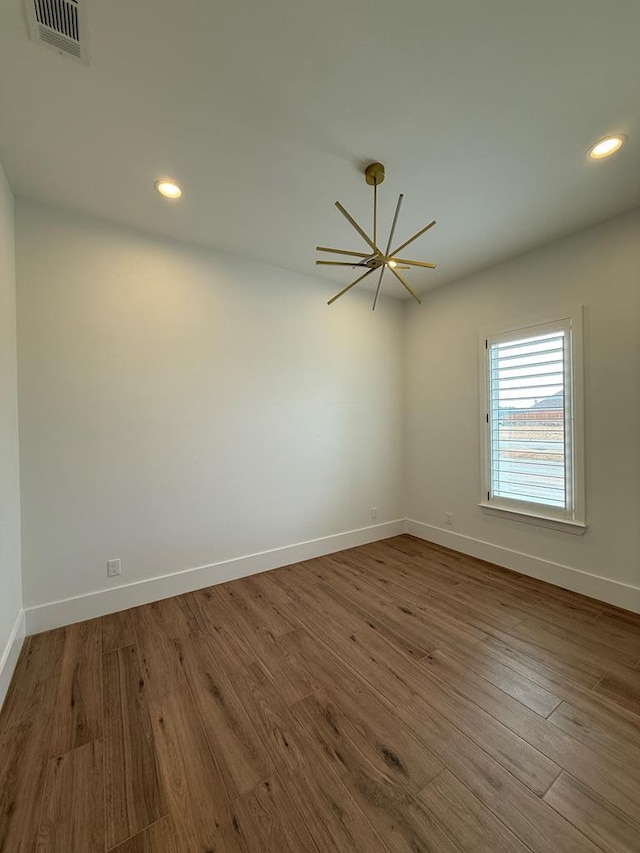 empty room with wood-type flooring