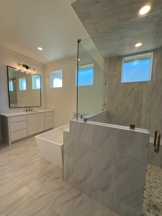 bathroom featuring separate shower and tub and vanity