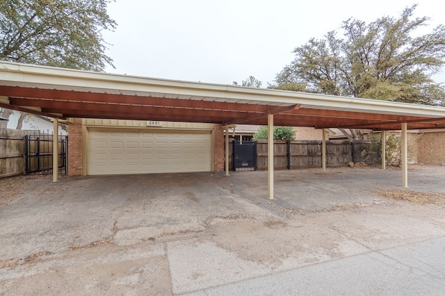 garage featuring a carport