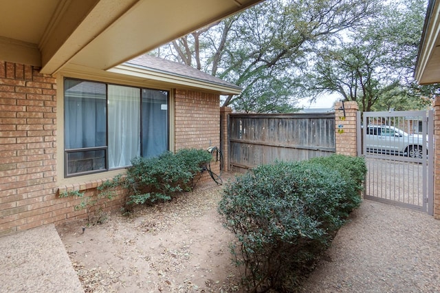 exterior space with a gate and fence