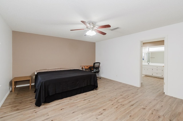 bedroom featuring ceiling fan, connected bathroom, and light hardwood / wood-style floors