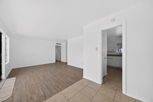 204 Acklen, Midland, TX 79703 - unfurnished room with light wood finished floors and a smoke detector
