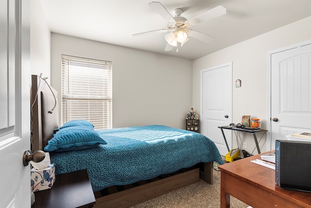 carpeted bedroom featuring ceiling fan