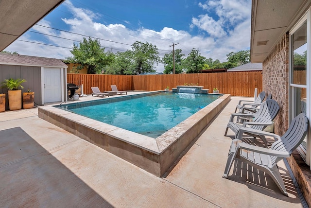 3513 Stanolind Ave, Midland, TX 79707 - view of swimming pool featuring a patio area, a fenced backyard, and a storage shed
