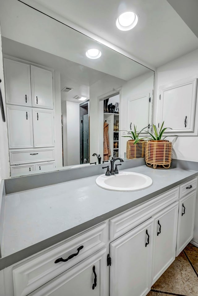 3513 Stanolind Ave, Midland, TX 79707 - bathroom with vanity, tile patterned flooring, and recessed lighting