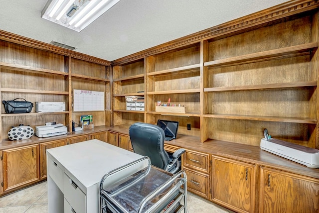 3513 Stanolind Ave, Midland, TX 79707 - office area with built in study area, a textured ceiling, and light tile patterned floors