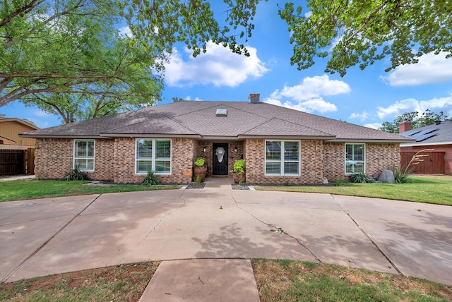 3513 Stanolind Ave, Midland, TX 79707 - view of front facade with brick siding and a shingled roof
